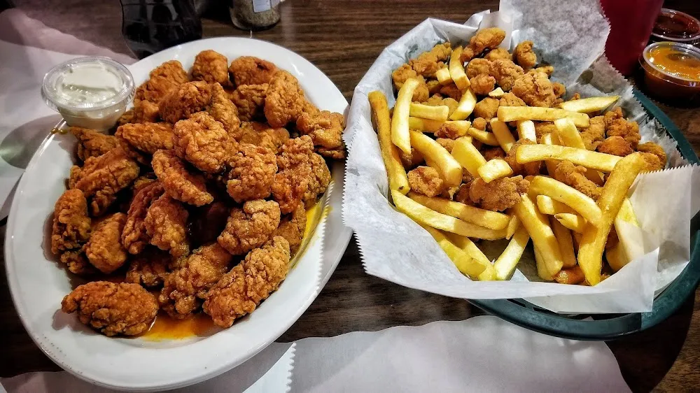 Boneless Chicken Wings and Popcorn Chicken and French Fries